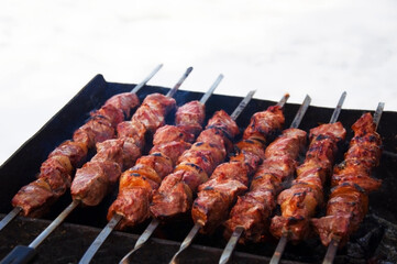 meat kebabs cooked on the grill in winter. High quality photo