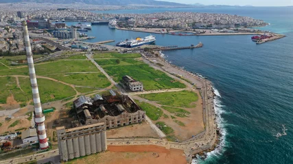  Aerial drone view from abandoned public fertiliser factory as seen at sunny winter slightly cloudy morning, Piraeus main port, Attica, Greece © aerial-drone