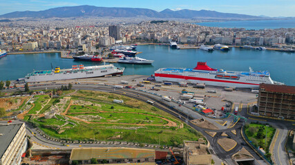 Aerial drone photo of busy port of Piraeus, the largest in Greece and one of the largest passenger ports in Europe as seen from old fertiliser factory, Attica, Greece 
