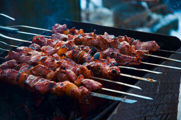 meat kebabs cooked on the grill in winter. High quality photo