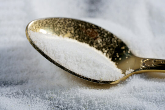Makrogol powder photographed against a black background in the studio