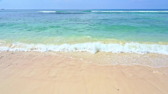 Turquoise Tropical Sea Waves Breaking on Sandy Beach, Slow Motion Full Frame