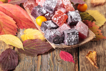 Solid homemade marmalade in an old wooden dish.