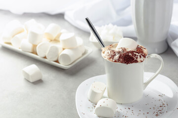 Hot chocolate with marshmallows sprinkled with chocolate crumbs.