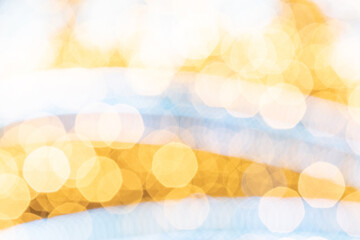 Gold black abstract light bokeh. Festive glitter blur background. Christmas and New Year holidays...