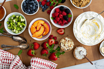 Yogurt bowl bar, big board with variety of toppings