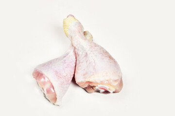 Raw chicken legs isolated on white background