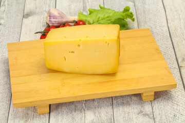 Hard yellow tasty cheese brick