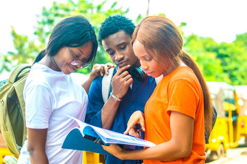 Three young african students studying together