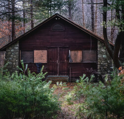 Scary cabin in the woods abandonded and decaying