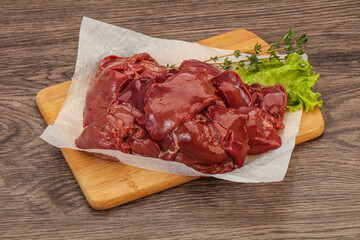 Raw chicken liver over board