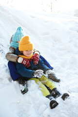 Children have fun playing in the winter snow Park.