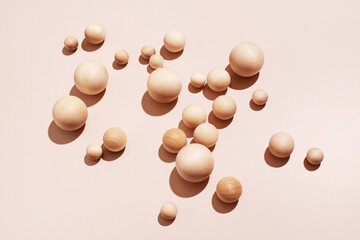 Abstract beige background of wooden balls, trendy composition