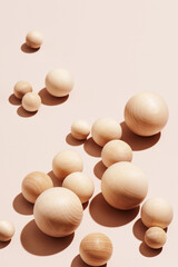 Abstract beige background of wooden balls, trendy composition