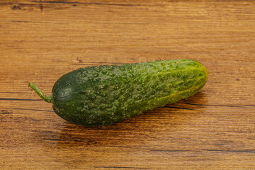 Green ripe fresh cucumber over background