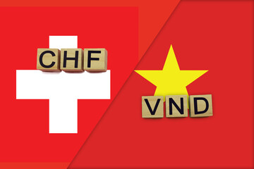 Switzerland and Vietnam currencies codes on national flags background