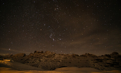 Fototapeta na wymiar winter night sky in the Swiss alps with snow and mountains in Melchsee-Frutt
