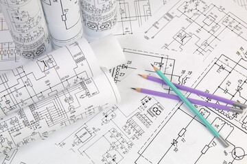 Work of an electronic engineer. Electrical engineering drawings close up.