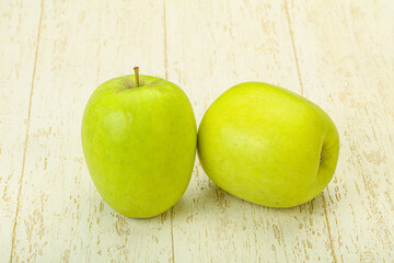 Two ripe green sweet apples
