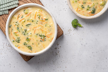 Bowl of broccoli and cheddar cheese soup - obrazy, fototapety, plakaty