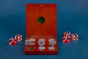 Tic Tac Toe in wooden box and dice, close up, shallow depth of field