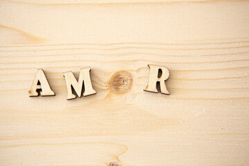 wooden letters with the word "amor" written