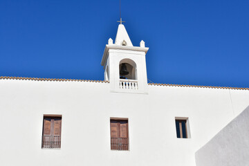 Obraz premium Ibiza, Spain - January 17, 2021: Ibiza San Miguel Sant Miquel de Balansat white Mediterranean church on a sunny day..