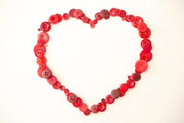 heart outline on white background made with red buttons