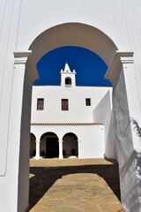 Fototapeta premium Ibiza, Spain - January 17, 2021: Ibiza San Miguel Sant Miquel de Balansat white Mediterranean church on a sunny day..