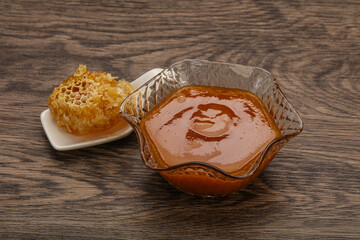 Natural honey in the bowl