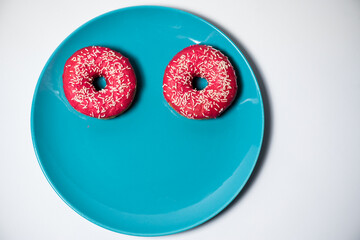 Pink donuts on the pastel plate