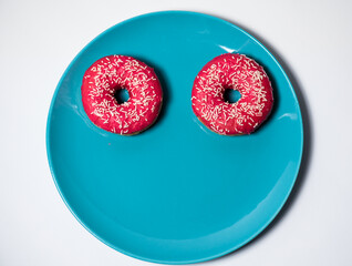 Pink donuts on the pastel plate