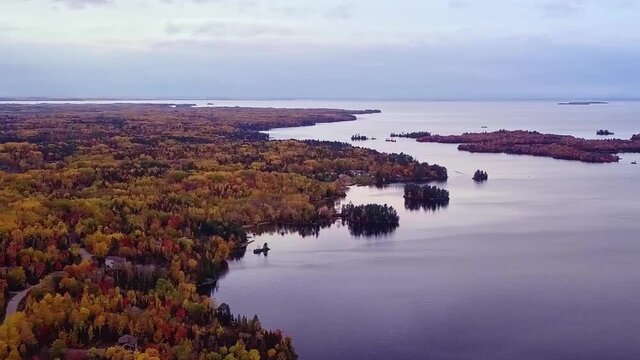 Slow pan of fall-coloured forests surrounding Callander Bay and Lake Nippissing.