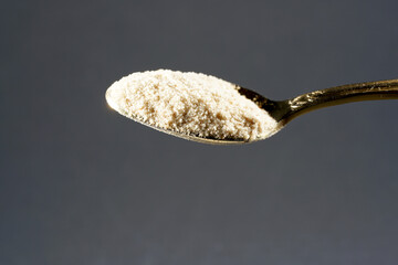 Ground Indian flea seeds photographed in the studio against a black background