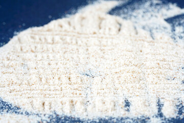 Ground Indian flea seeds photographed in the studio against a black background