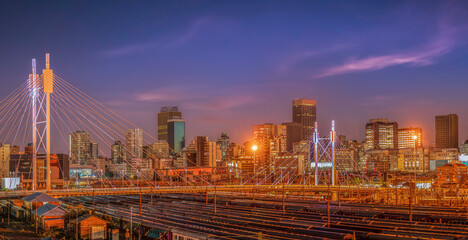 Nelson Mandela Bridge and Johannesburg city lit up at night