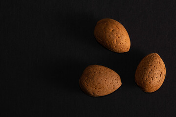 Almonds in nutshell isolated over black background