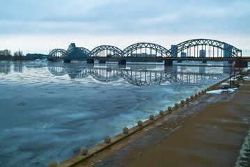 Riga,the embankment of the city. in the background is a river and a railway bridge