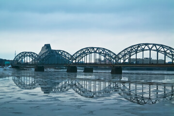 Riga,the embankment of the city. in the background is a river and a railway bridge