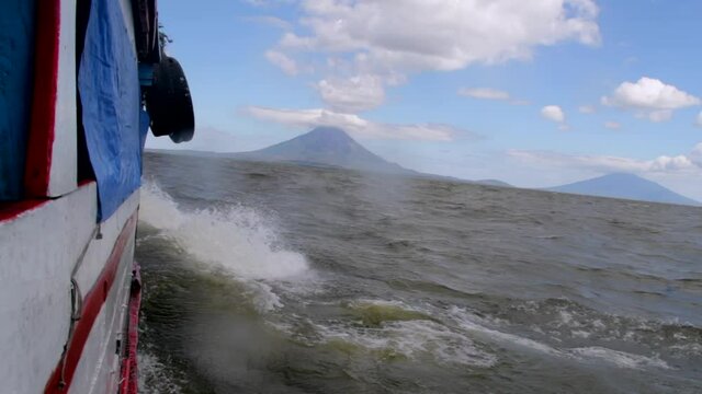 From the ferry on the way to Ometepe Islands portraying its two volcanoes in the distance as the ferry crosses the rowdy lake.