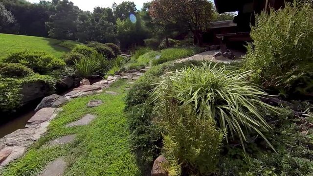 Steadicam shot moving along path of Japanese tea garden, or Roji.