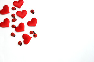Red hearts and Little Ladybugs on top left corner of white background - Valentines Day and Love Concept. Copy Space, Space for text.