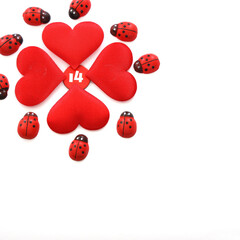 Ladybugs around the clover shaped red Hearts with number fourteen in the middle, on the top left corner of white background, Love and Valentines Day Concept. Copy Space, Space for text.