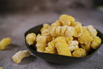 Fresh homemade uncooked gnocchi Italian dumplings, selective focus