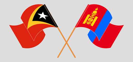 Crossed and waving flags of East Timor and Mongolia