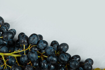 A bunch of red grapes on blue background