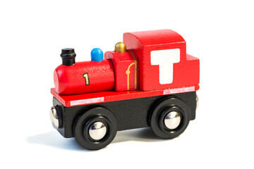 Toy train isolated on a white background. Colorful wooden toy train isolated on white background