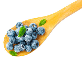Fresh blueberries with green leaves in a wooden spoon on a white background.
