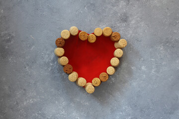 Valentine heart from wine corks on stone background