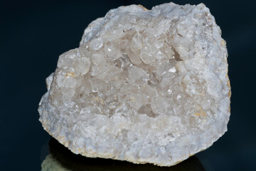Quartz geode isolated on blue